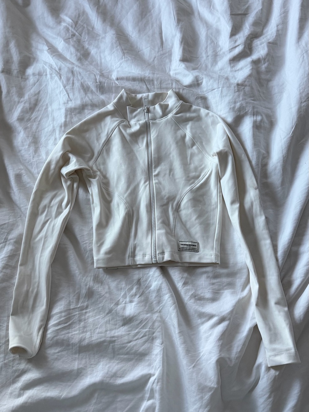 Cropped White Zip-Front Jacket — The Giving Movement
